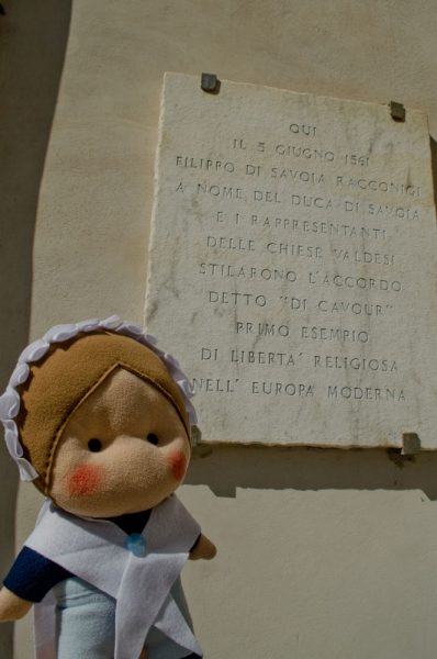 A plaque affixed on the building, reminding the important event